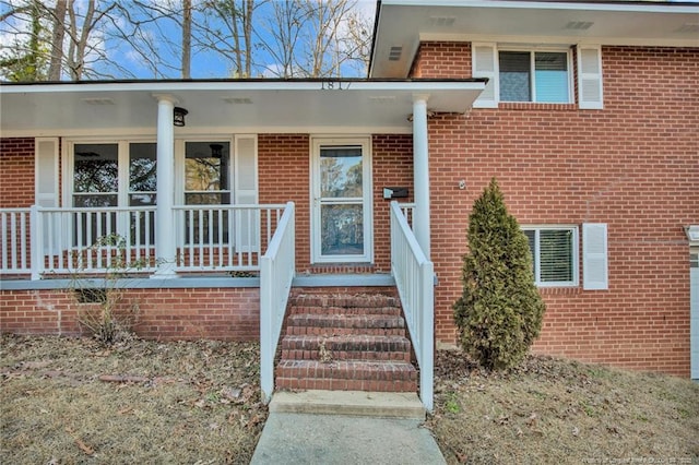 doorway to property with covered porch