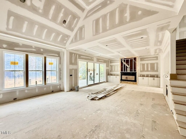 unfurnished living room featuring plenty of natural light