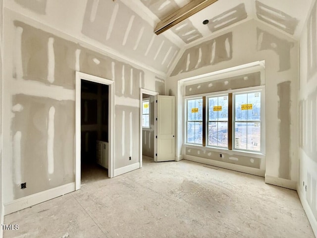 unfurnished bedroom featuring lofted ceiling