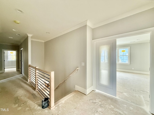 interior space with visible vents, baseboards, and ornamental molding