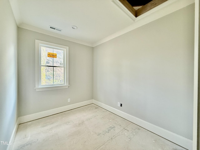 unfurnished room featuring visible vents, baseboards, and crown molding