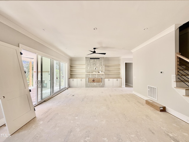 unfurnished living room featuring crown molding, stairway, baseboards, and visible vents