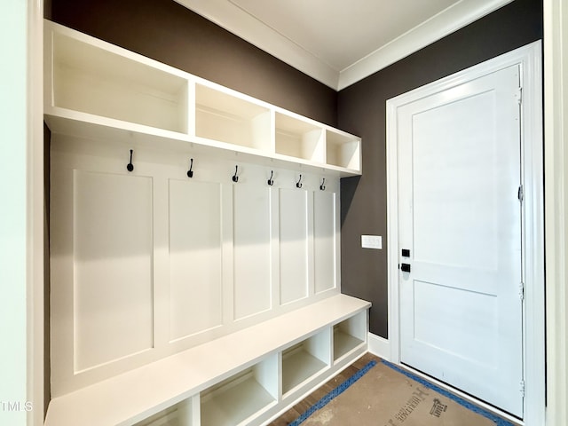 mudroom with baseboards and ornamental molding