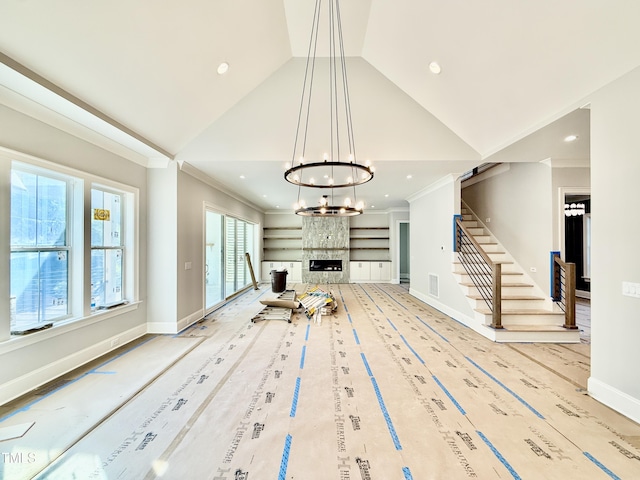 unfurnished living room featuring recessed lighting and stairs