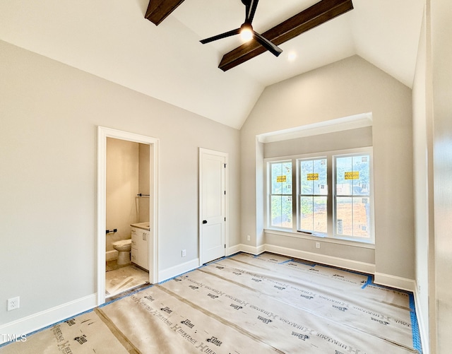 unfurnished bedroom with ceiling fan, lofted ceiling, ensuite bathroom, and baseboards