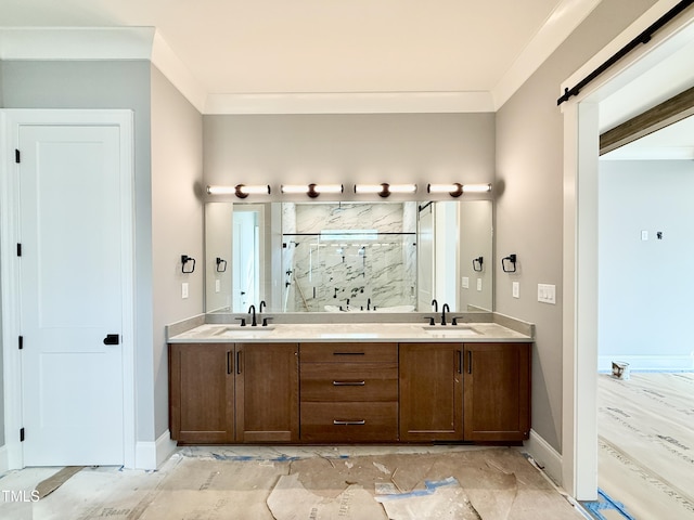 full bath with baseboards, a sink, a marble finish shower, and double vanity