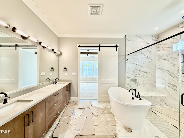 full bath with a soaking tub, visible vents, a marble finish shower, and a sink