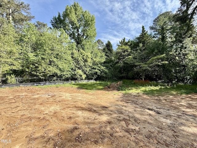 view of yard featuring a wooded view