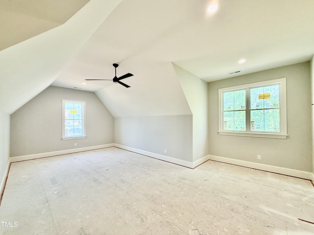 bonus room with vaulted ceiling, visible vents, and baseboards