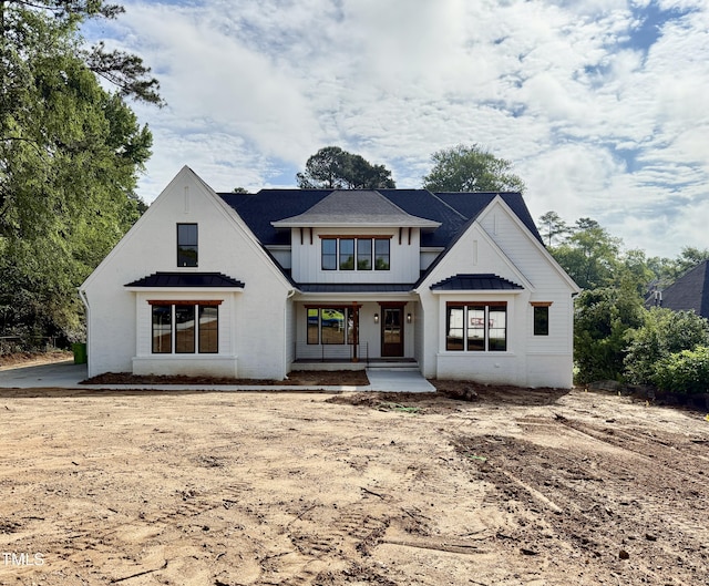 5820 Shawood Dr, Raleigh, NC 27609 - view of front facade featuring a porch, a standing seam roof, metal roof, and board and batten siding