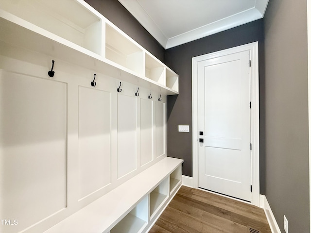 5820 Shawood Dr, Raleigh, NC 27609 - mudroom featuring wood finished floors, baseboards, and crown molding