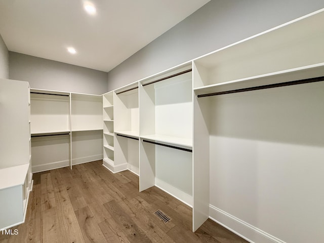 5820 Shawood Dr, Raleigh, NC 27609 - walk in closet featuring light wood-style flooring