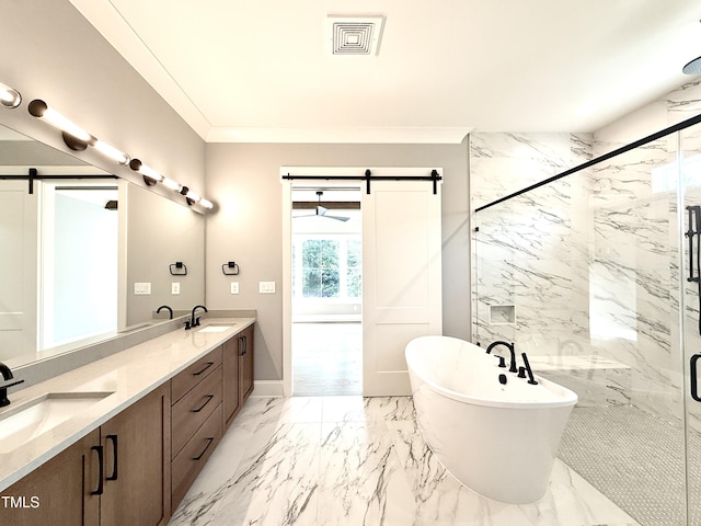 5820 Shawood Dr, Raleigh, NC 27609 - full bath with a marble finish shower, a soaking tub, marble tiled flooring, double vanity, and crown molding