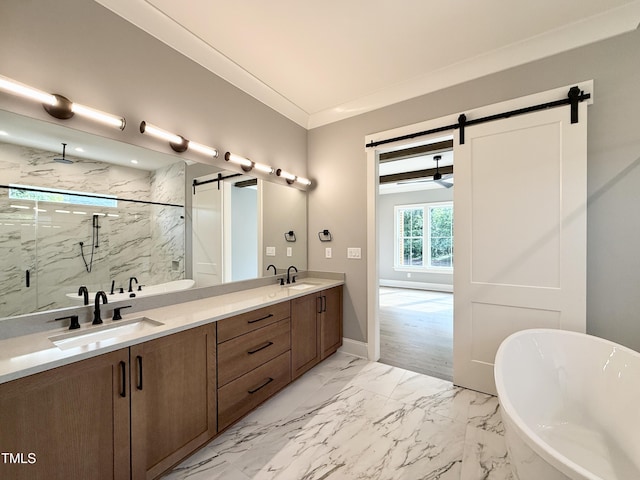 5820 Shawood Dr, Raleigh, NC 27609 - bathroom featuring a marble finish shower, a freestanding bath, double vanity, marble look tile flooring, and baseboards