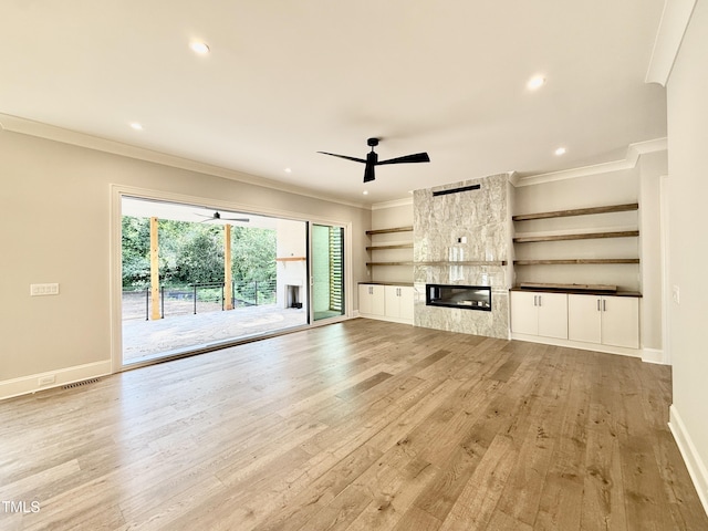 5820 Shawood Dr, Raleigh, NC 27609 - unfurnished living room with light wood-type flooring, crown molding, a ceiling fan, recessed lighting, and baseboards