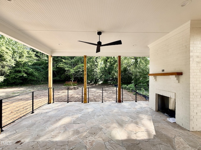 5820 Shawood Dr, Raleigh, NC 27609 - view of patio / terrace with a ceiling fan, fence, an outdoor brick fireplace, and view of scattered trees
