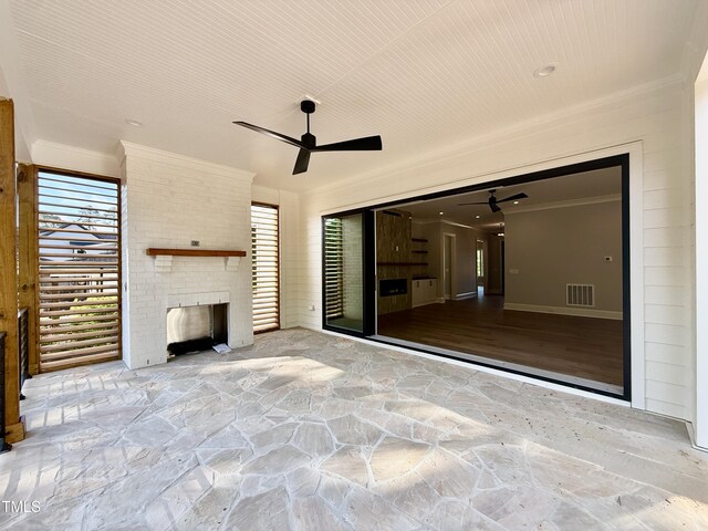 5820 Shawood Dr, Raleigh, NC 27609 - view of patio with an outdoor brick fireplace and ceiling fan