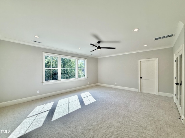 5820 Shawood Dr, Raleigh, NC 27609 - spare room featuring light carpet, ornamental molding, ceiling fan, baseboards, and recessed lighting