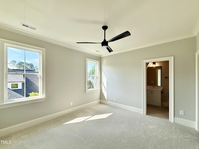 5820 Shawood Dr, Raleigh, NC 27609 - unfurnished bedroom with carpet flooring, baseboards, ornamental molding, and ensuite bathroom
