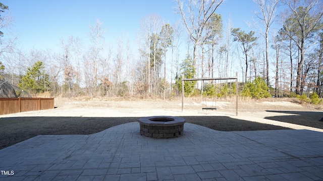 view of patio / terrace with an outdoor fire pit