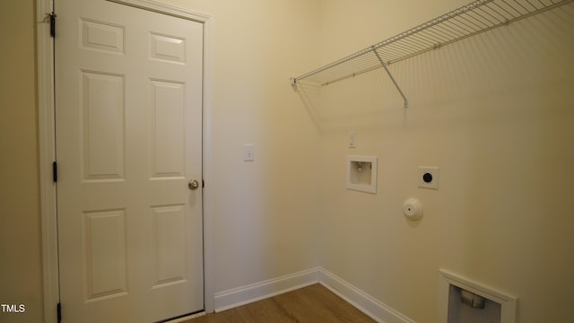 laundry room with hookup for a washing machine, wood-type flooring, hookup for an electric dryer, and hookup for a gas dryer