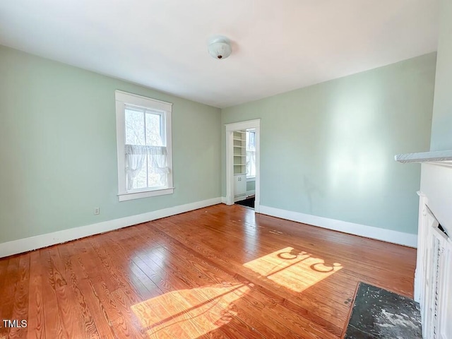 unfurnished living room featuring light hardwood / wood-style floors