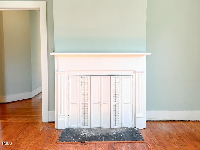 interior details featuring hardwood / wood-style floors