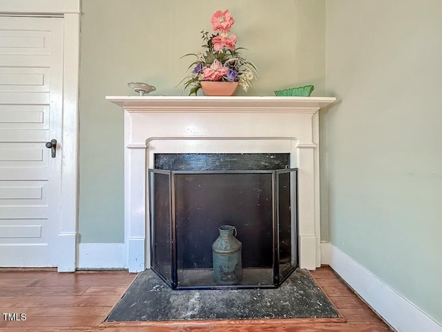 interior details featuring hardwood / wood-style flooring