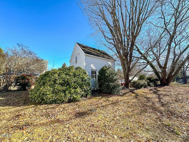 view of home's exterior featuring a lawn