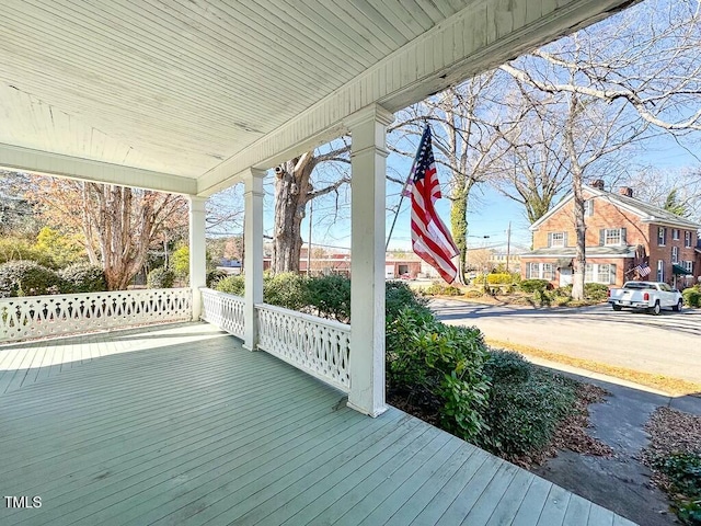 wooden terrace with a porch