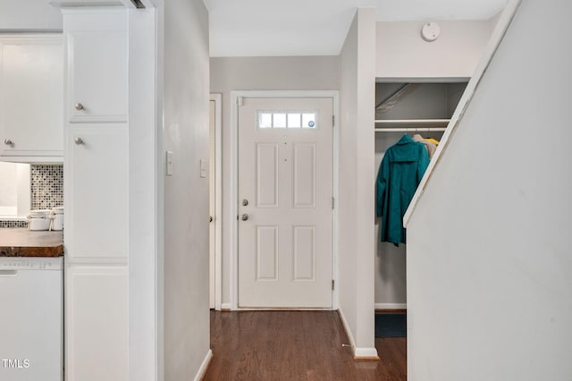 foyer entrance with dark hardwood / wood-style floors