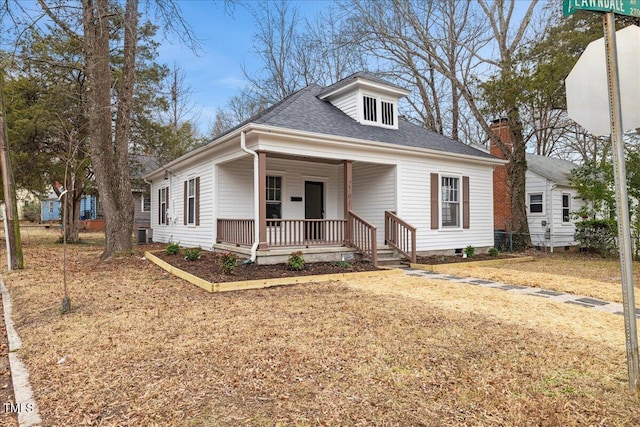 bungalow-style house with cooling unit and covered porch