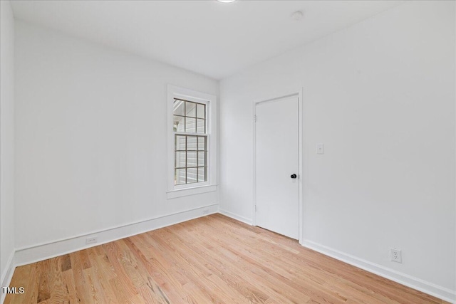 unfurnished room featuring light hardwood / wood-style floors