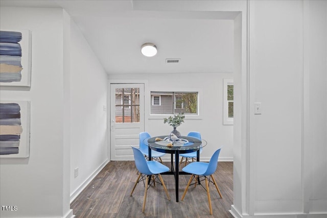 dining room with dark wood-type flooring