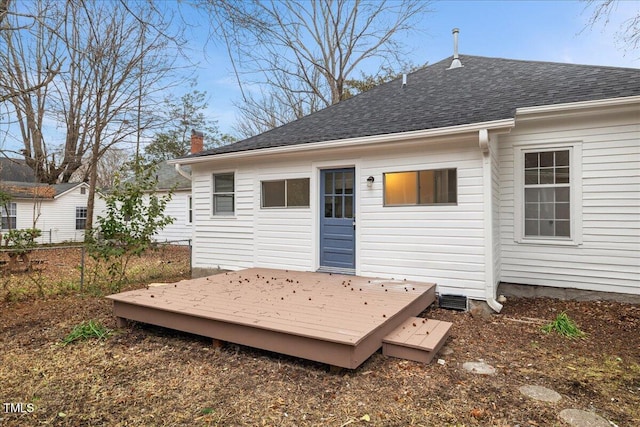 rear view of property with a wooden deck