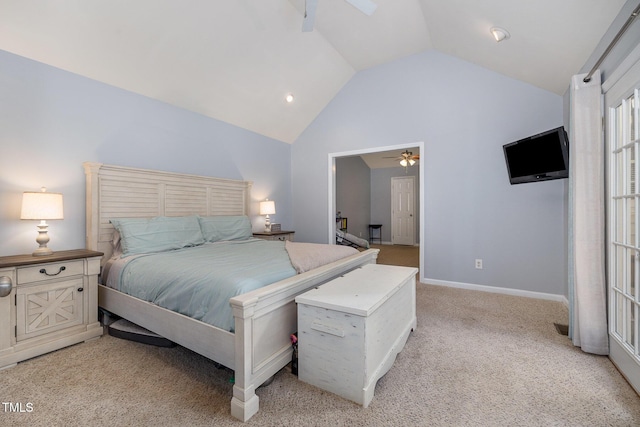 bedroom with light colored carpet and high vaulted ceiling