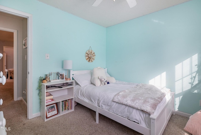 carpeted bedroom featuring ceiling fan