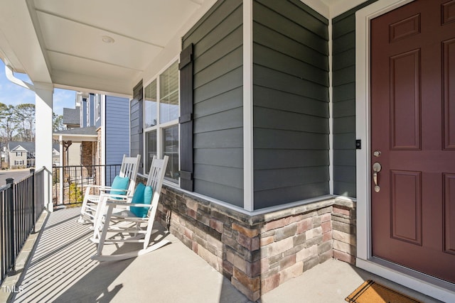 doorway to property with covered porch