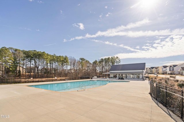 view of pool featuring a patio area