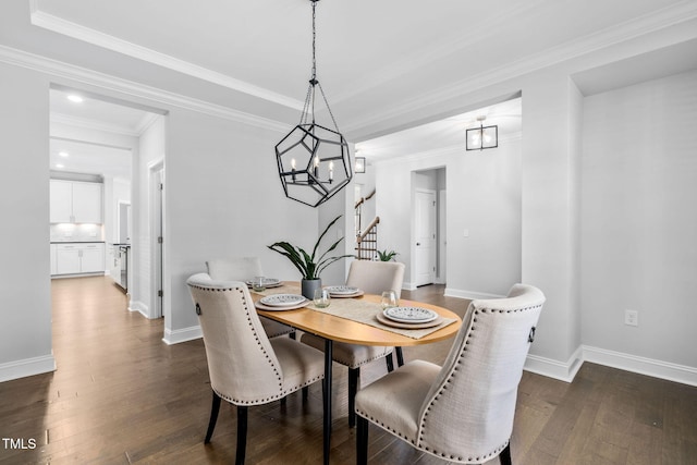 dining room featuring ornamental molding and dark hardwood / wood-style flooring