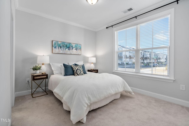 carpeted bedroom with ornamental molding