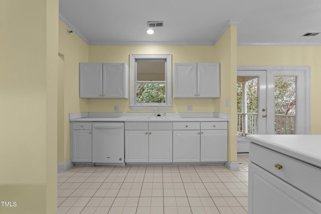 kitchen featuring white dishwasher, sink, white cabinetry, and ornamental molding