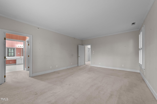 carpeted empty room featuring ornamental molding