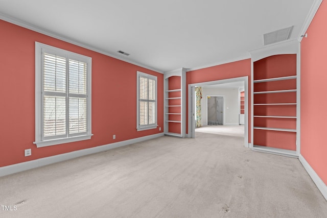 carpeted empty room with crown molding