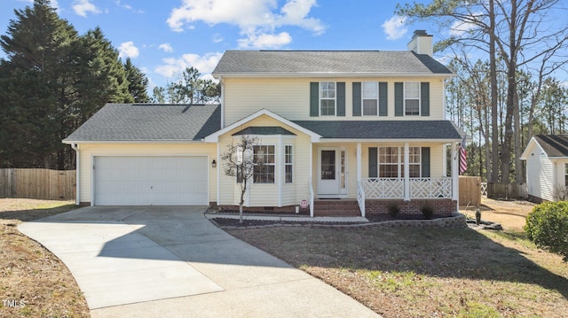 view of front facade with a garage and covered porch