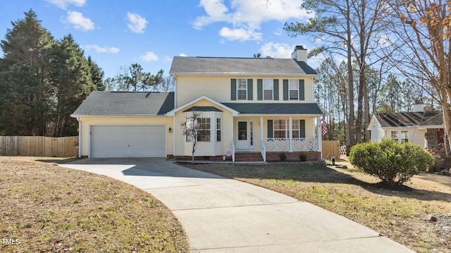 colonial-style house with a garage, covered porch, and a front lawn