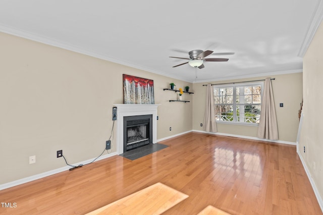 unfurnished living room featuring crown molding, wood-type flooring, and ceiling fan