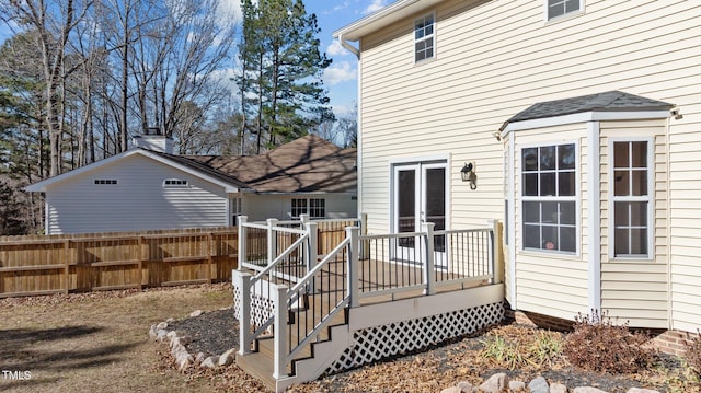 rear view of property with a wooden deck