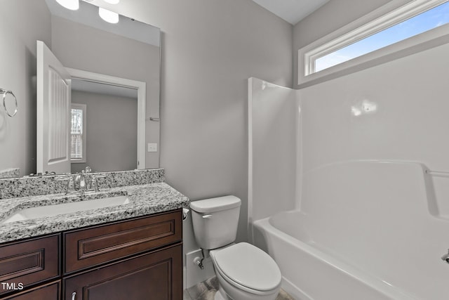 full bathroom featuring shower / bathtub combination, vanity, and toilet