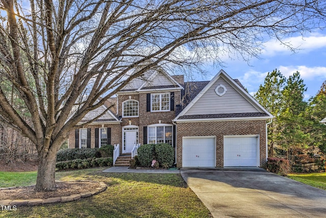 view of front of property with a garage and a front yard